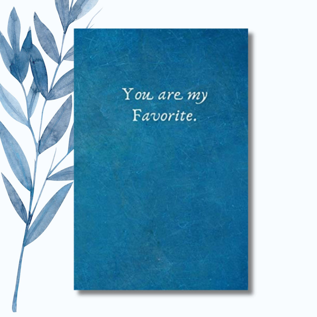 A notebook featuring the phrase "You Are My Favorite" on a sleek, glossy cover. Thoughtful and minimalist notebook design, perfect for gifting to someone special.