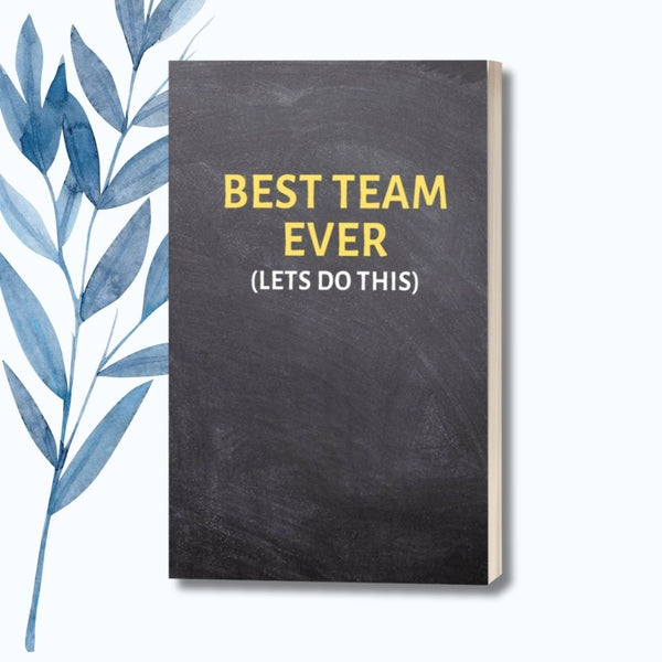 A 6" x 9" notebook with a black chalkboard-style cover featuring the bold phrase "Best Team Ever (Let's Do This)" in yellow text.