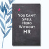 A notebook featuring the phrase "You Can’t Spell Hero Without HR" on a glossy, bold cover. Humorous and uplifting notebook design perfect for HR professionals and workplace recognition.