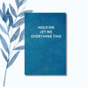 A notebook featuring the humorous phrase "Hold On Let Me Overthink This" on a glossy cover.