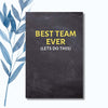 Motivational team notebook with a sleek black cover and bright typography, ideal for meetings and notes.