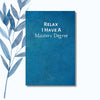 A notebook featuring the phrase "Relax, I Have a Master’s Degree" on a sleek, glossy cover.