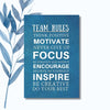 A notebook featuring the inspirational phrase "Team Rules: Motivate, Focus, Inspire" on a sleek, blue textured cover.