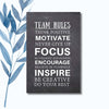 A notebook featuring the phrase "Team Rules" on a sleek, glossy cover.