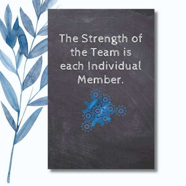 A notebook featuring the phrase "The Strength of the Team Is Each Individual Member" on a glossy, motivational cover.