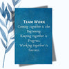 A notebook featuring the phrase "Teamwork: Coming Together Is the Beginning" on a sleek, glossy cover.