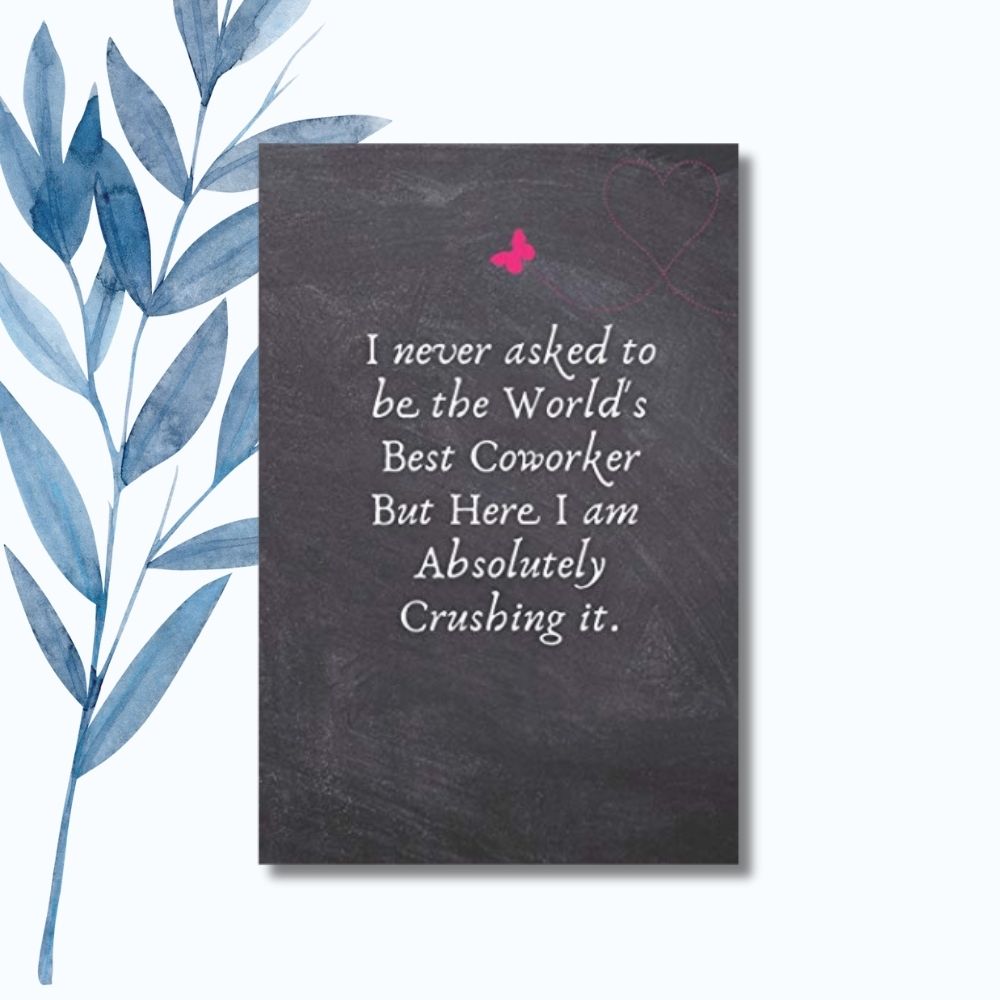 A notebook with the phrase "I Never Asked to Be the World's Best Coworker But Here I Am Absolutely Crushing It" on a black chalkboard-style cover with pink heart details.  ideal for gifting to coworkers or team members.